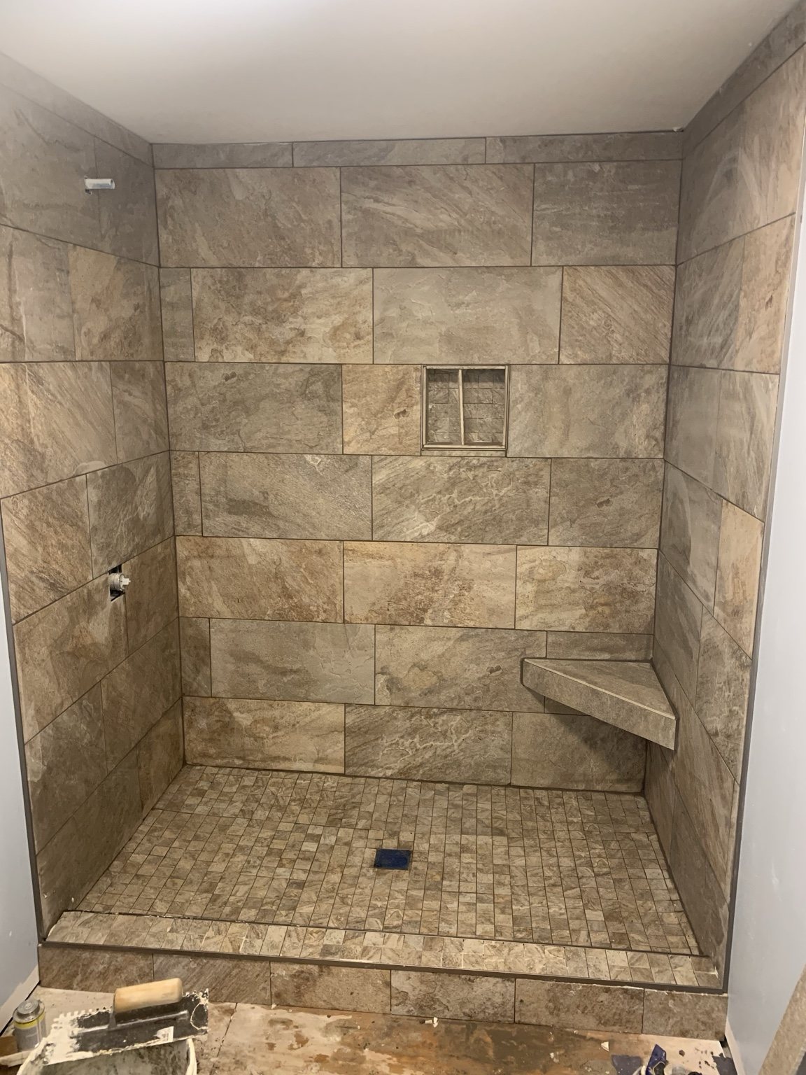 Large format stone-look tile shower
